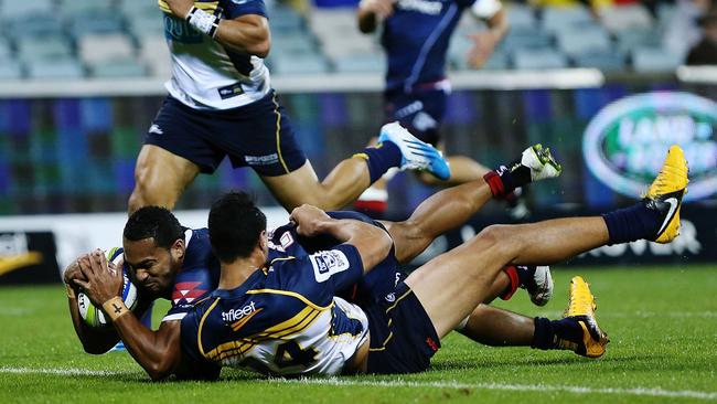 Sefanaia Naivalu of the Rebels scores a try.