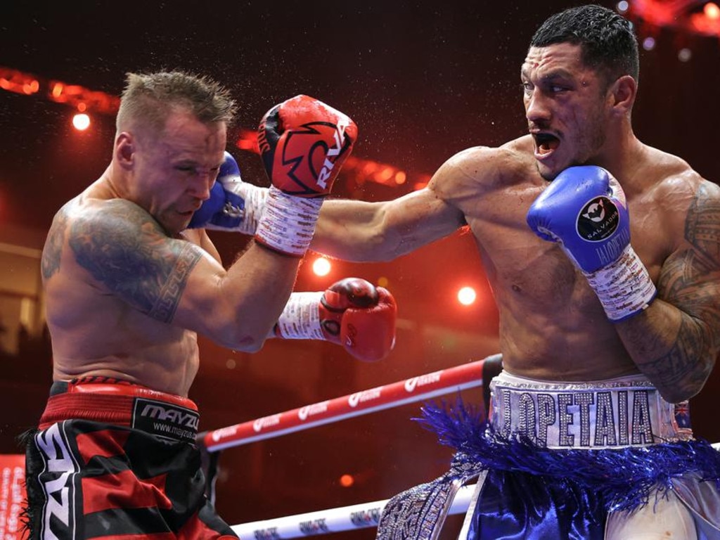 Jai Opetaia lands a heavy punch on Mairis Briedis. Picture: Top Rank/Mikey Williams