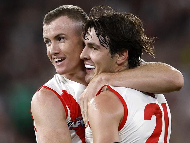 Sydney's Chad Warner and Errol Gulden celebrate setting up a goal to Logan McDonald during the Round 1 AFL match between the Collingwood Magpies and the Sydney Swans at the MCG on March 15, 2024. Photo by Phil Hillyard(Image Supplied for Editorial Use only - Phil Hillyard  **NO ON SALES** - Â©Phil Hillyard )