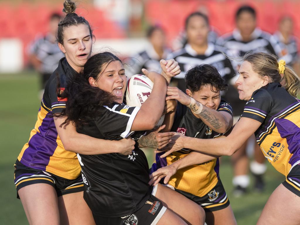 Poppie Collins of Oakey is wrapped up by the Gatton defence. Picture: Kevin Farmer.