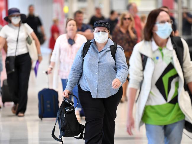 BRISBANE, AUSTRALIA - NewsWire Photos - NOVEMBER 3, 2020.Passengers arrive at Brisbane airport on a Qantas flight from Sydney, one of the first in since the Queensland - NSW border was relaxed. Visitors from regional New South Wales are allowed into Queensland without having to quarantine, but those in the greater Sydney area are still subject to previous restrictions.Picture: NCA NewsWire / Dan Peled