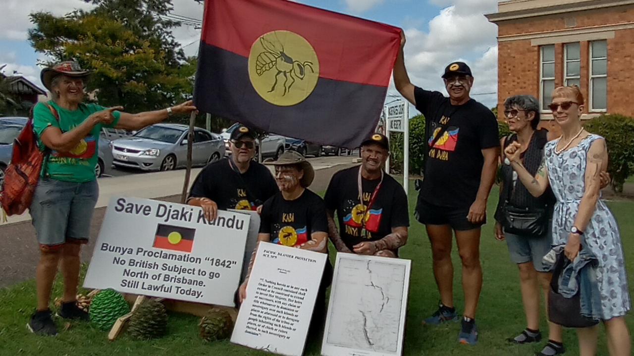 A Facebook post on community group Kabi Dreaming shows the group celebrating outside Gympie court when their charges were discontinued.