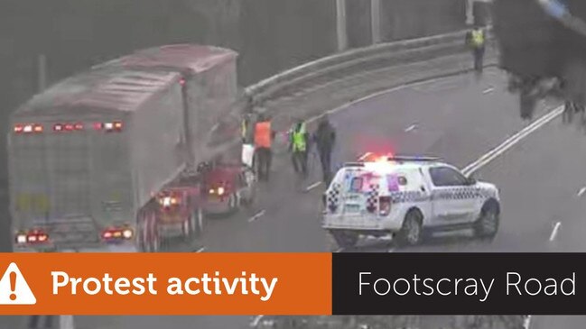 Police on scene at a protest at Shepherds Bridge on Footscray Rd in Footscray.