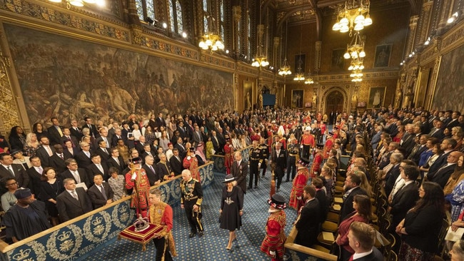 Charles, the duchess and William make their way down the Royal Gallery. Picture: Richard Phole