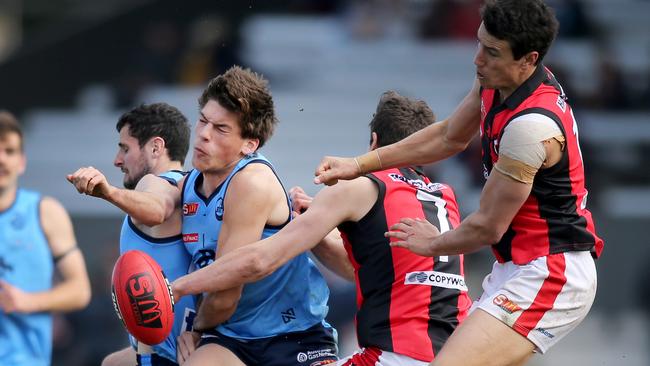 West's Tom Keough and Chris Burgess in a crunch with Sturt's Hugo Munn and Matt Crocker. Picture: AAP/Dean Martin.