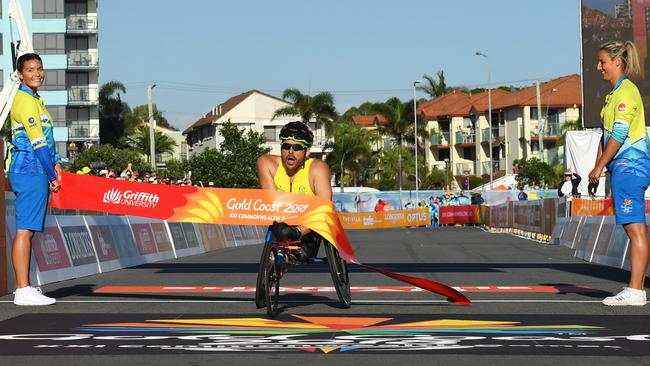 A spent Kurt Fearnley crosses the finish line more than a minute ahead of his nearest rival. Picture: Getty Images