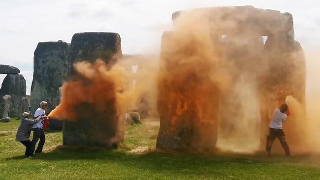 Climate protesters sprayed orange powder paint on the prehistoric UK site. Picture: AFP/Just Stop Oil