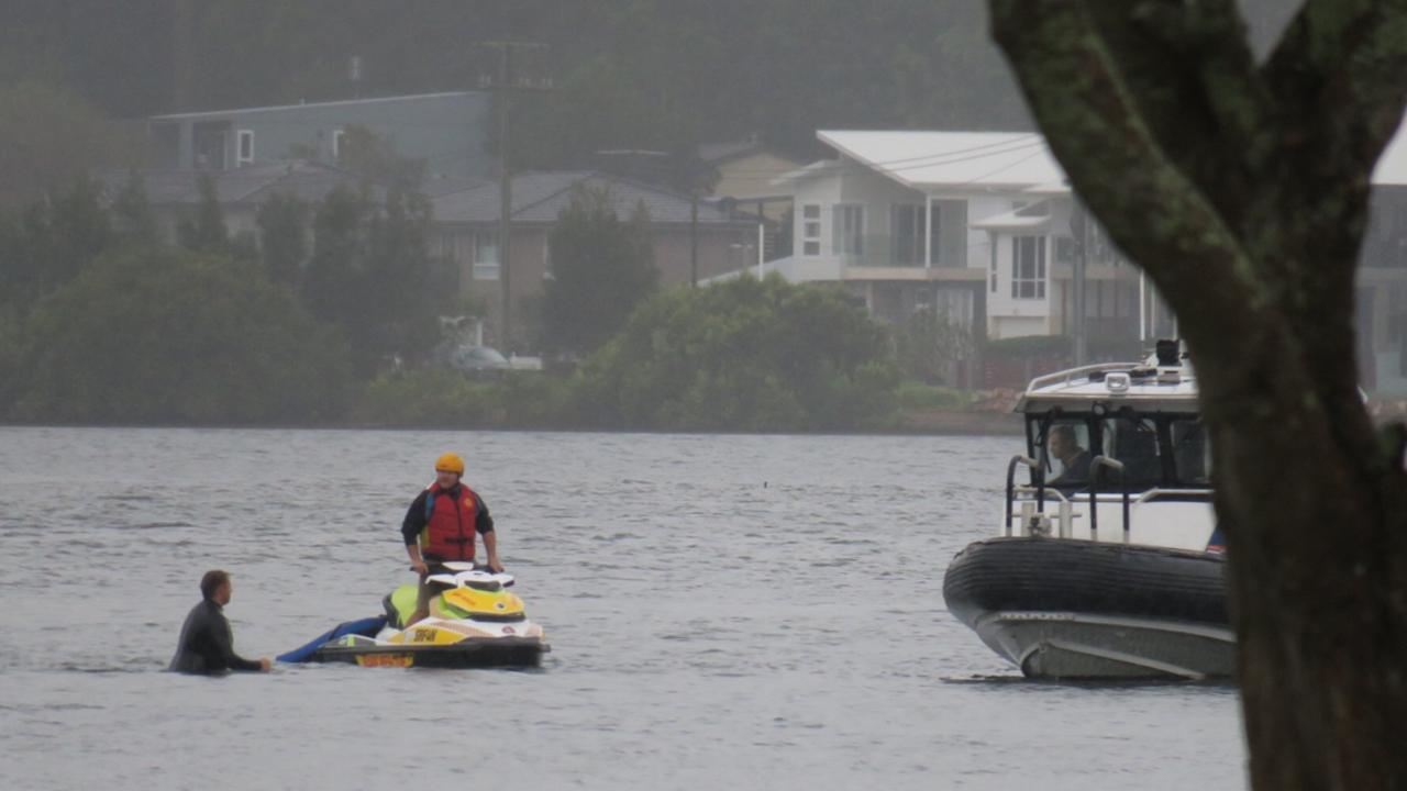 Emergency services responding to a car that has driven off a boat ramp at Lions Park in Woy Woy. Picture: Richard Noone