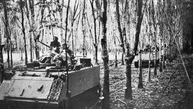 A troop of M113A1 Armoured Personnel Carriers of A Squadron, 3 Cavalry Regiment, Royal Australian Armoured Corps, passing through a rubber plantation during Operation Ivanhoe. Picture: Australian War Memorial/P07256.014