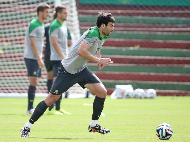 Mile Jedinak trains with the Socceroos in Vitoria, Brazil, yesterday before the kick-off of the 2014 World Cup. Picture: George Salpigtidis