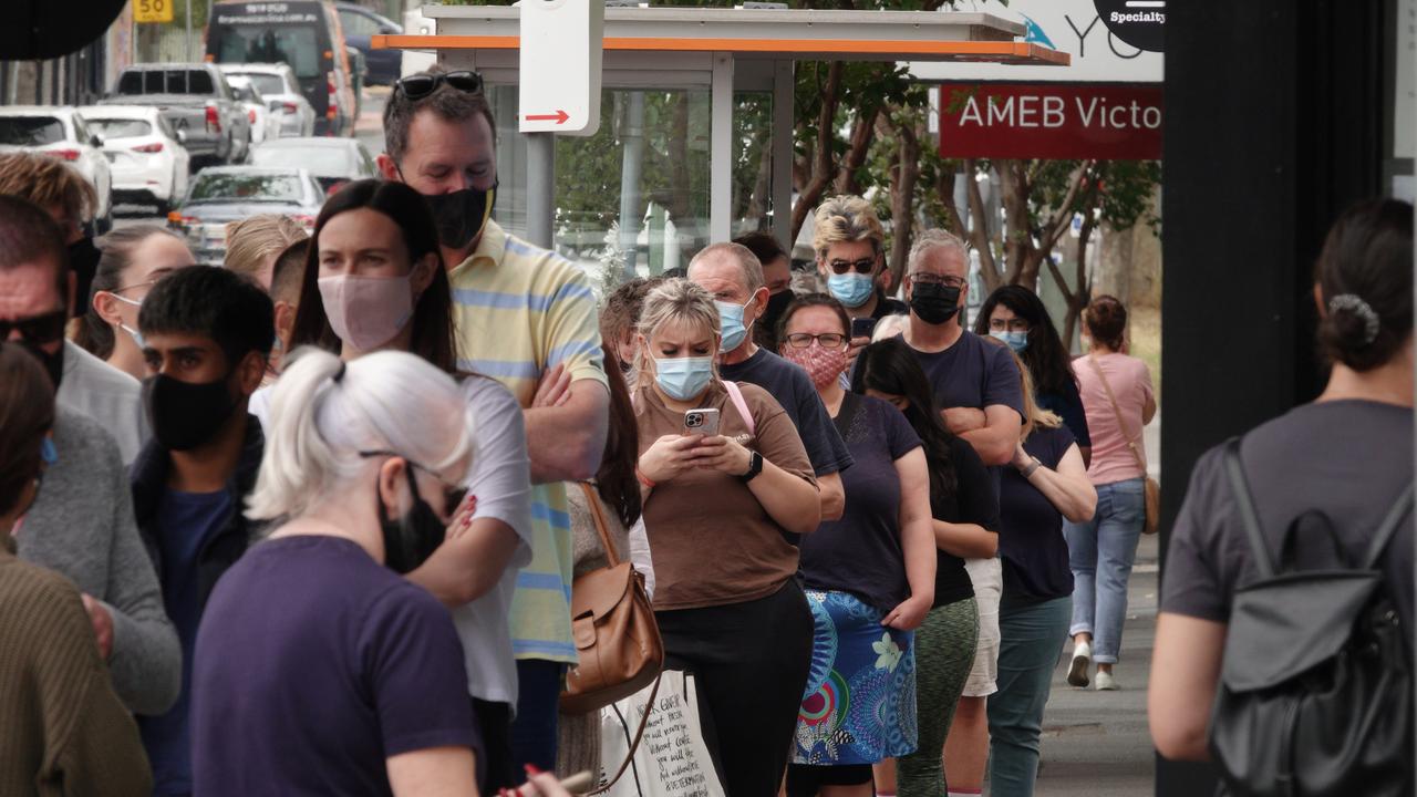 A large queue of people outside a Hawthorn East pharmacy lining up for Rapid Antigen Tests. Picture: Alex Coppel.