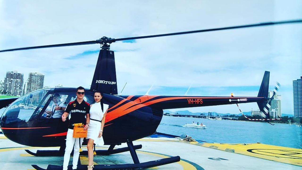 Controversial share trader Tyson Scholz, pictured with partner Sophie Anderson, often shows off his lavish lifestyle. Picture: Instagram