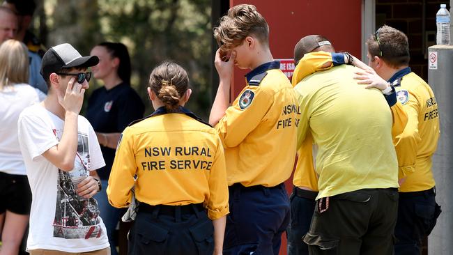 Devastated members of the Horsley Park RFS and public at the Horsley Park Rural Fire Brigade in Horsley Park, NSW. Picture: AAP