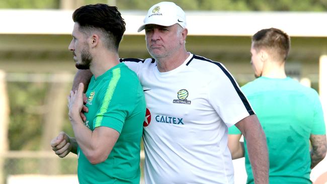 Socceroos coach Graham Arnold, right, with Mathew Leckie, during a training session in Brisbane earlier this week. Picture: AAP