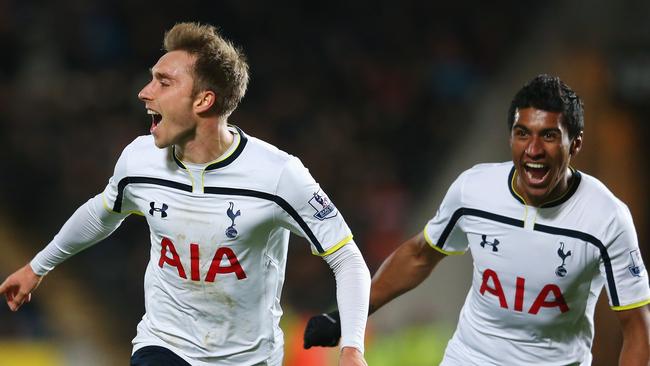 HULL, ENGLAND - NOVEMBER 23: Christian Eriksen of Tottenham Hotspur celebrates scoring the winning goal with Paulinho during the Barclays Premier League match between Hull City and Tottenham Hotspur at KC Stadium on November 23, 2014 in Hull, England. (Photo by Alex Livesey/Getty Images)