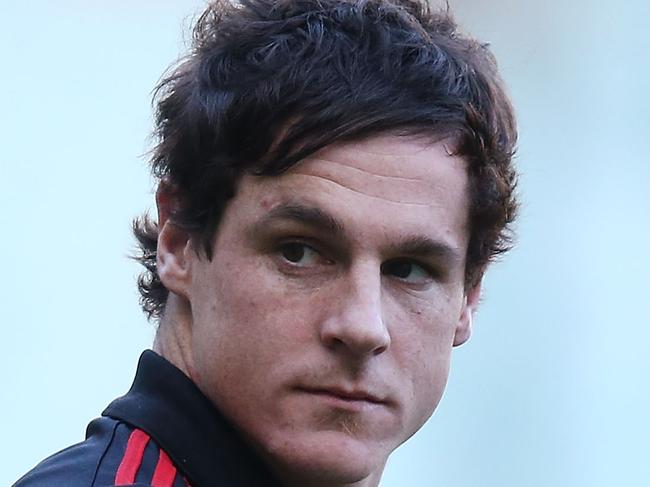 MELBOURNE, AUSTRALIA - SEPTEMBER 06: Jake Carlisle of the Bombers, injured with a hamstring, looks upfield before warm up during the Second Elimination AFL Final match between the North Melbourne Kangaroos and the Essendon Bombers at Melbourne Cricket Ground on September 6, 2014 in Melbourne, Australia. (Photo by Michael Dodge/Getty Images)