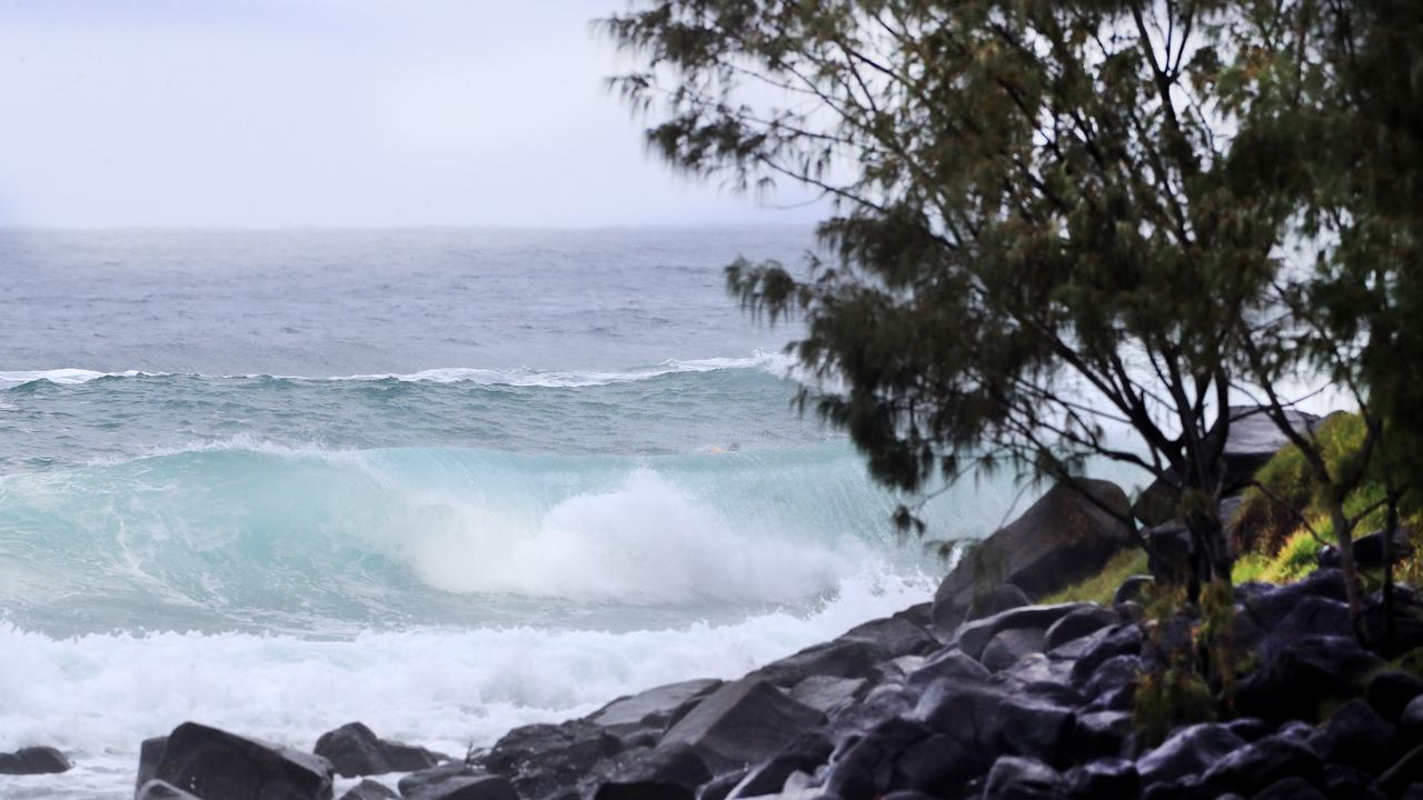 Waves pick up at Burleigh Beach as wet weather descended over the Gold Coast. Photo: Scott PowickNEWSCORP