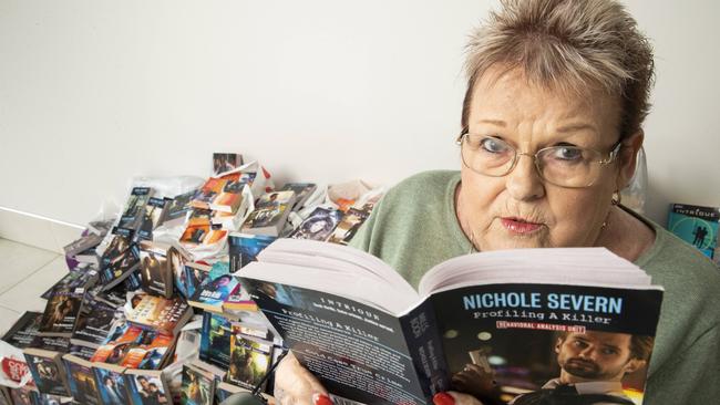 Pelican Waters mum Kerin O'Sullivan is selling her large Mills and Boon novel collection. Picture: Lachie Millard