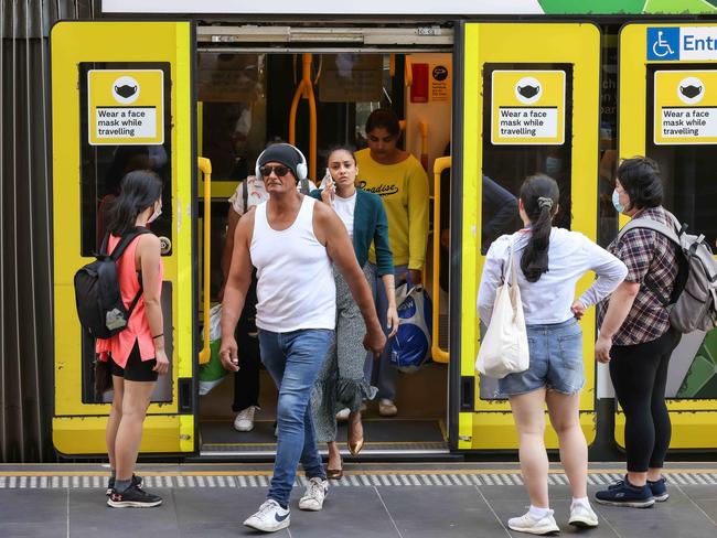 Some people are choosing to no longer wear a mask on public transport. Picture: Ian Currie