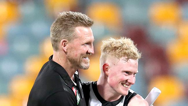 Collingwood coach Nathan Buckley celebrates with John Noble after the Magpies 24-point win over Carlton at the Gabba. (Photo by Jono Searle/AFL Photos/via Getty Images)