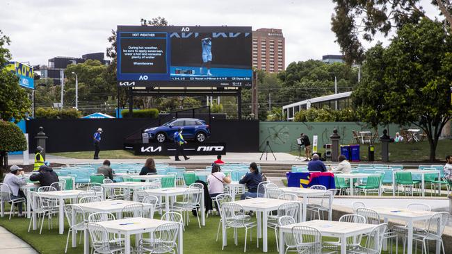 People sitting in garden square at the Australian Open. Picture: Aaron Francis.