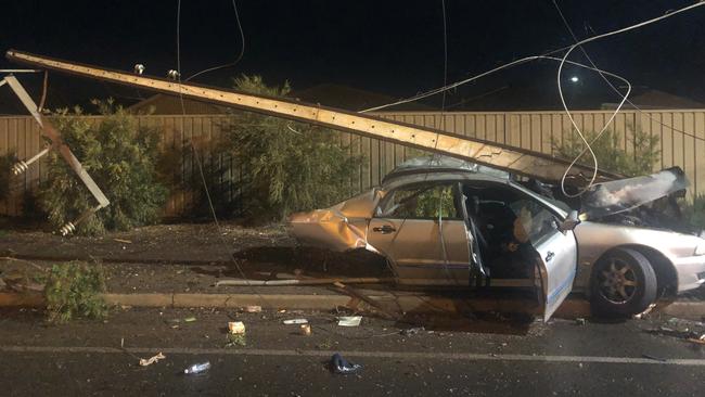 A driver managed to escape serious injuries after crashing into three Stobie poles, tearing the vehicle into two pieces. Picture: Supplied