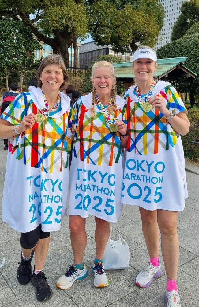 Jen Shaw, Mel Ferrier and Kelly Graves show off their medals after completing the Tokyo Marathon.