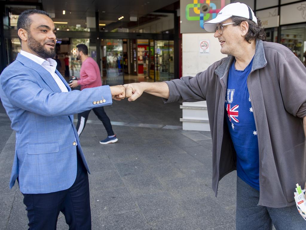 Mr Ouf greets a member of the public in Auburn on Tuesday. Picture: NewsWire