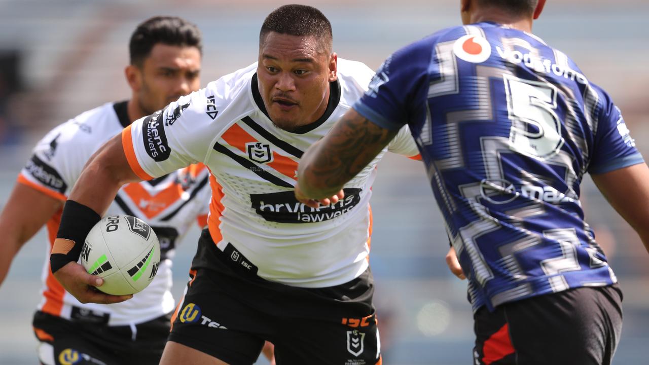 West Tigers Joseph Leilua makes a break during the NRL trial match between the Warriors and the Tigers