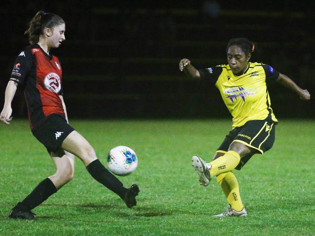 Lions' Tonia-Marie Rantucci and Tigers' Xena Faddy fight for possession in the FNQ Football Premiership Women's match between the Edge Hill Tigers and the Lichhardt Lions, held at Tier Park, Manunda. Picture: Brendan Radke