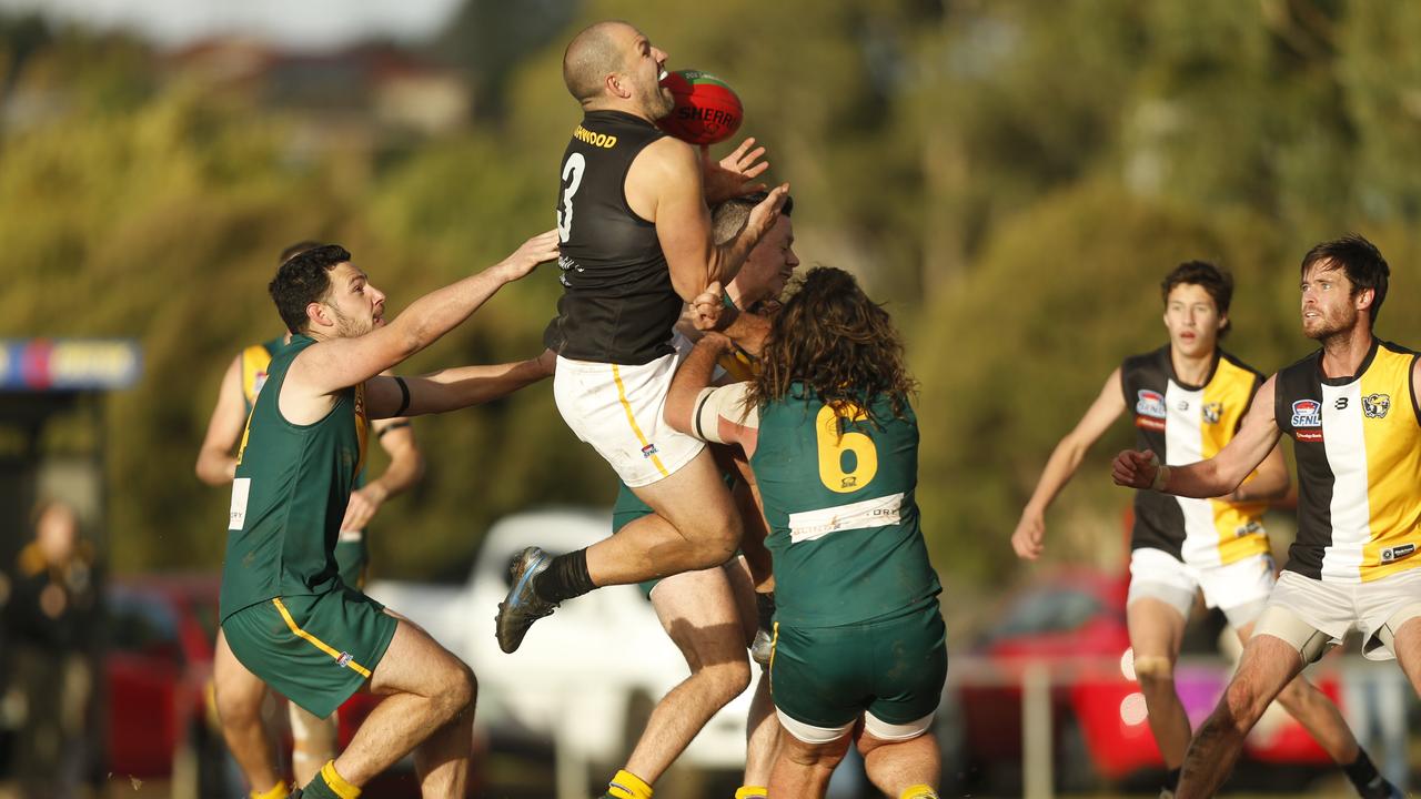 Southern: Ashwood’s Jack Purcell flies for a mark against Endeavour Hills. Picture: Valeriu Campan