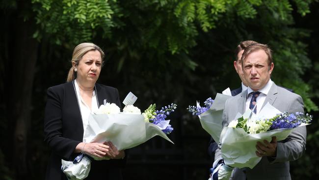 Premier Annastacia Palaszczuk and Steven Mile Dick laying flowers for fallen QPS officers at the Police memorial in the city Botanic Gardens. Pic: Annette Dew