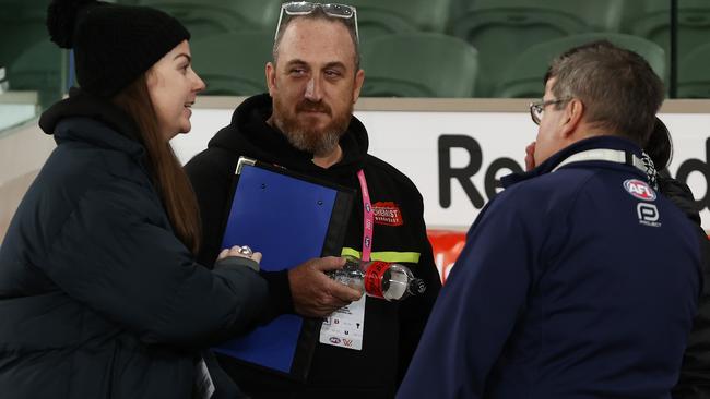 North Melbourne and AFL interchange staff talk after the Kangaroos’ loss to Sydney at Marvel Stadium. Picture: Michael Klein