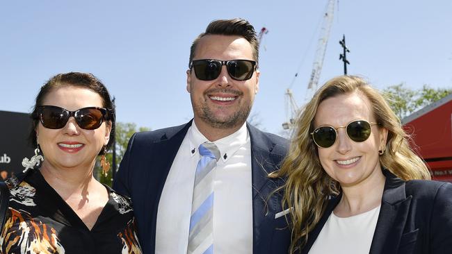 Caulfield Guineas horse race meeting, Caulfield, Victoria, Saturday 12th October 2024. Faces in the crowd. Pictured enjoying the race meeting are Monique, Gareth and Lauren. Picture: Andrew Batsch