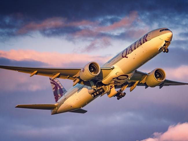 Qatar Airways Boeing 777 taking off from London Heathrow Airport during sunset. Date: May 25, 2022