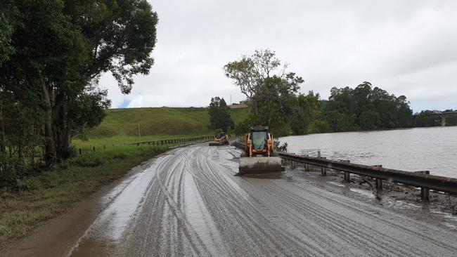 Tweed Shire Council workers have been working to clean up Dulguigan Rd in North Tumbulgum after floodwaters receded.