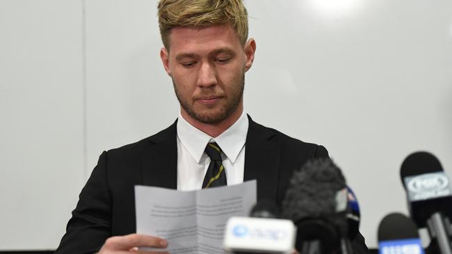 Nathan Broad reads from a prepared statement.