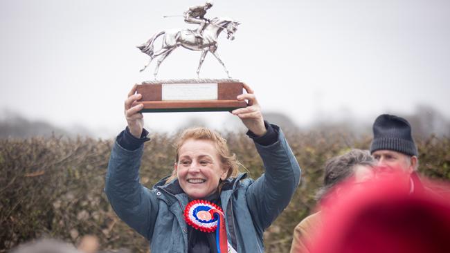 Winner Julie Campbell holds her trophy aloft. Picture: Robert Buck