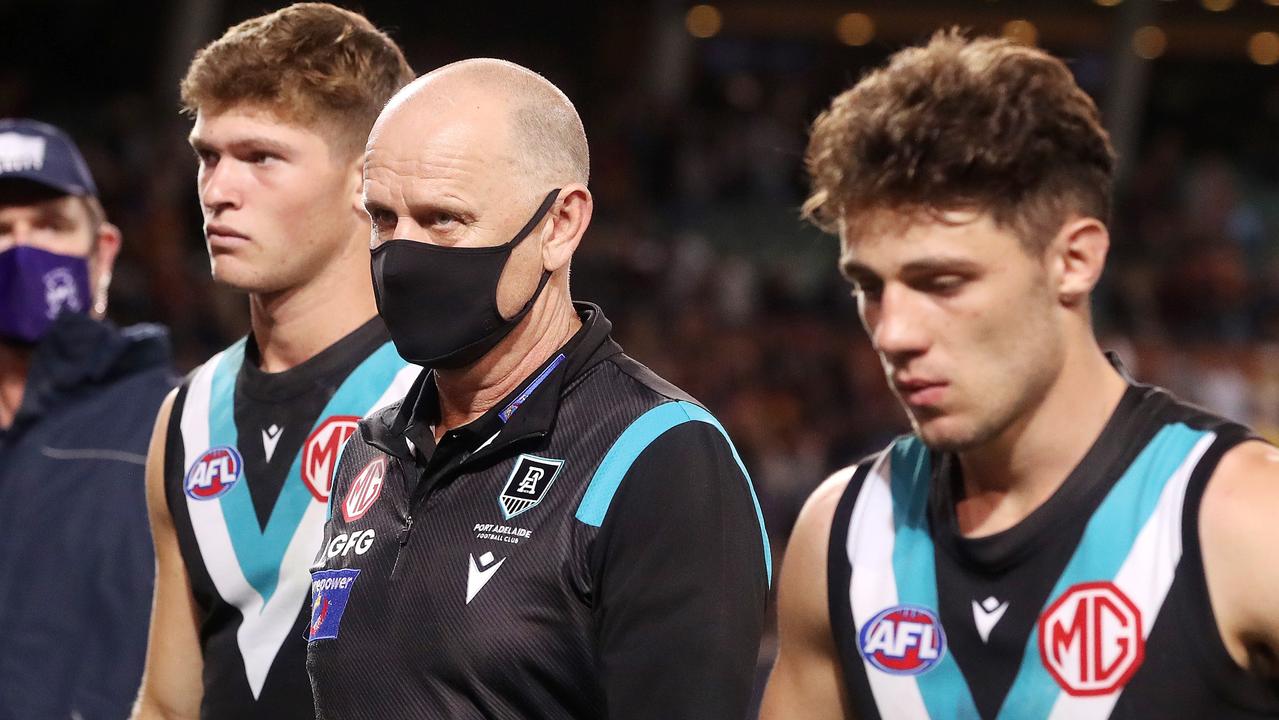 Ken Hinkley walks off with his players after the loss to Adelaide. Picture: Sarah Reed