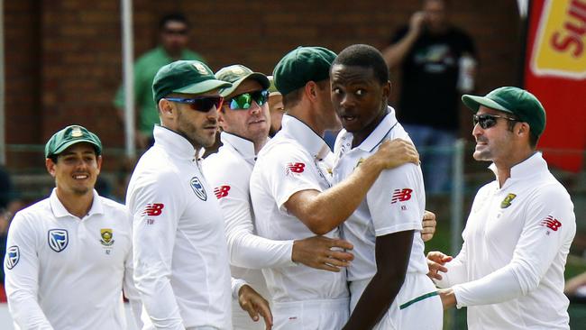 South Africa's bowler Kagiso Rabada, second right, with teammate celebrates after dismissing Australia's batsman Shaun Marsh, for 24 runs on the first day of the second cricket test match between South Africa and Australia at St George's Park in Port Elizabeth, South Africa, Friday, March 9, 2018. (AP Photo/Michael Sheehan)