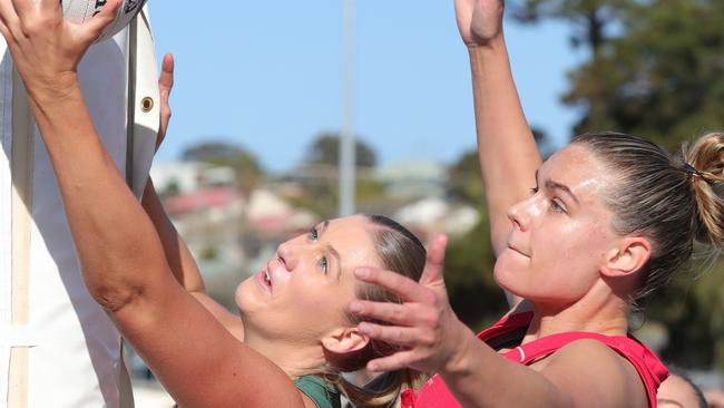 Geelong Amateur goal shooter Ruby Watson and Ocean Grove goal keeper Georgia Berry fight for the ball in the qualifying final. Picture: Mark Wilson
