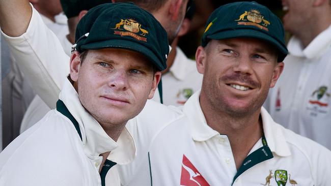 Steve Smith (L), then-captain of Australia and teammate David Warner (R) wait to start the day’s play during day one of the second cricket Test match between New Zealand and Australia at Hagley Park in Christchurch on February 20, 2016. Picture: AFP / Marty Melville.