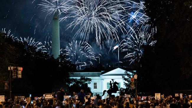 Fire works light up a protest outside the White House against Donald Trump’s nomination on Thursday night. Picture: AFP