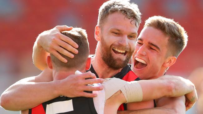 Devon Smith of Essendon celebrates with Jake Stringer.