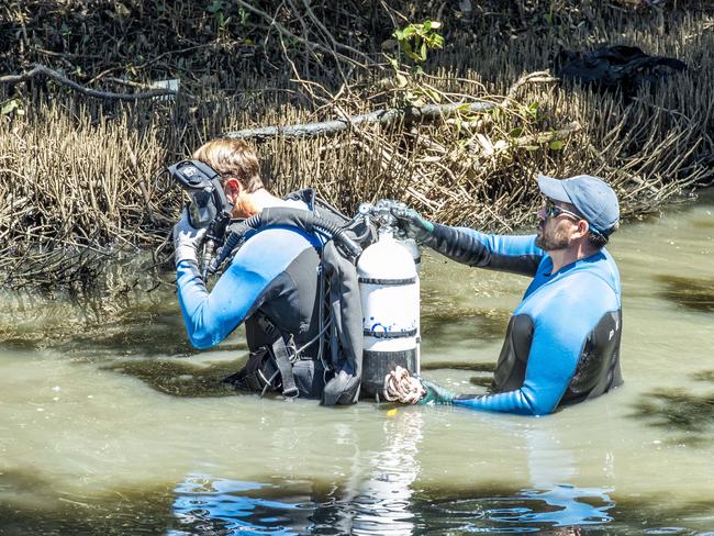 Police search a creek at Nudgee. Picture: Richard Walker