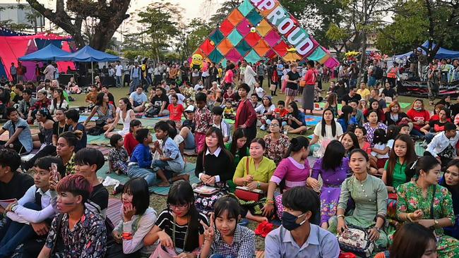 Members of the Myanmar's lesbian, gay, bisexual, and transgender (LGBT) community sit while they take part in the Yangon Pride festival in Yangon in 2018. (Photo by YE AUNG THU / AFP)