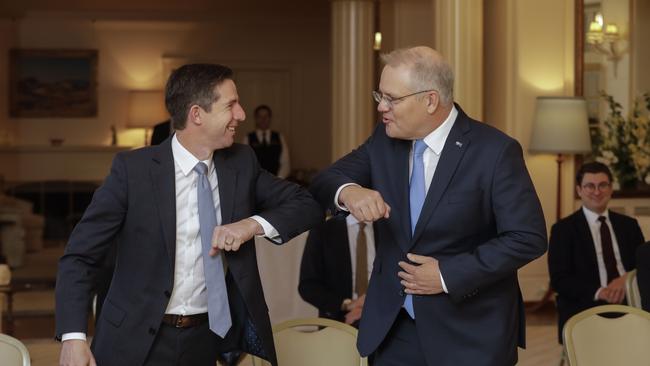 Simon Birmingham greets Prime Minister Scott Morrison at Government House in Canberra. Picture: Sean Davey.