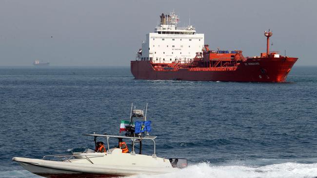 An Iranian Revolutionary Guard speedboat cruises past an oil tanker off the port of Bandar Abbas in southern Iran. Picture: AFP