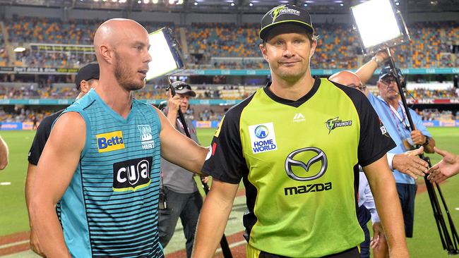 Brisbane Heat captain Chris Lynn (left) and Sydney Thunder skipper Shane Watson after Thursday night’s match at the Gabba was declared a no-result. Picture: Getty Images