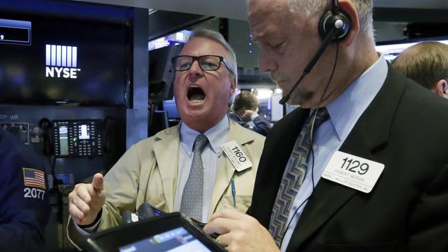 Trader Dermott Clancy, left, works on the floor of the New York Stock Exchange, Wednesday, Sept. 9, 2015. U.S. stocks are opening solidly higher as investors take their cue from big gains in Asia and Europe. (AP Photo/Richard Drew)